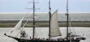 A heritage ship on the water. 