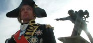 A historic actor as Lord Nelson standing next to a