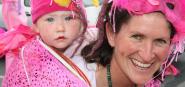 A mother and daughter dressed in pink for the mask