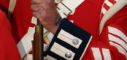A soldier in a red and blue uniform. 