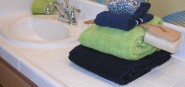 Towels on a bathroom counter. 