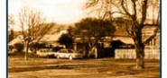 A sepia historic picture of a house. 