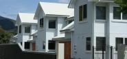 A row of white houses. 