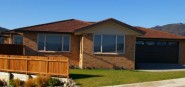 A brick house with garage. 