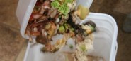 Food scraps being dumped into a compost bucket. 