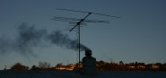 A dark outline of a smoky chimney. 