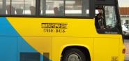 A yellow and blue Nelson bus.