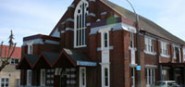 A red and white brick house. 
