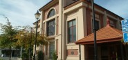 The exterior of a brick two storey building. 