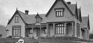 Black and white image of a historic house. 