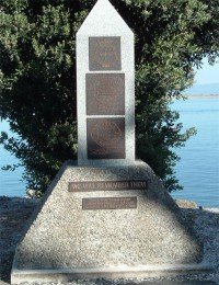 A statue with plaques on it. 