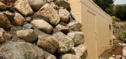 Rocks next to a pump station. 