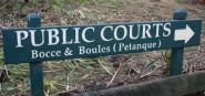 A green sign saying public courts. 
