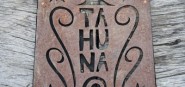 A piece of steel artwork with the word tahuna engr