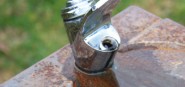 A water fountain spigot. 