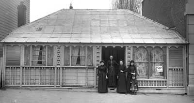 A historic image of a dressmaker's shop. 