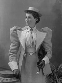 Black and white photo of Effie Richardson standing in a dress. 