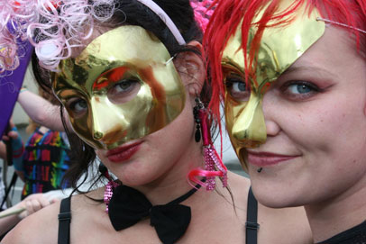 Two women participate in the Nelson Arts Festival Masked Parade. 