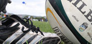 A rugby shoe and ball. 