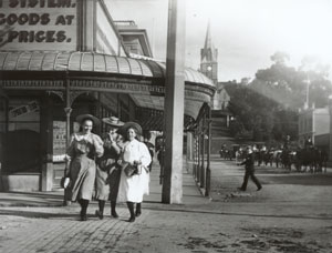 A black and white image of a town street. 