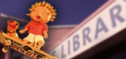 A picture of a clay figure on a skateboard. 