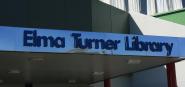 An exterior sign reading Elma Turner Library. 