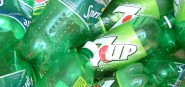 A pile of empty green plastic bottles. 
