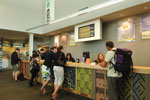 Customers being served at the counter of the Millers Acre Centre. 