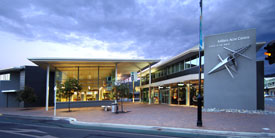 Exterior of the Millers Acre Centre at night. 